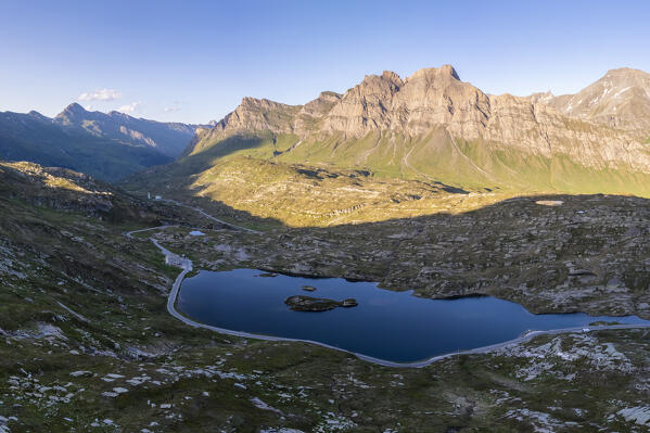 Aerial view of the laghetto Moesola and Piz Uccello in San Bernardino pass at sunset. Graubünden, Moesa district, Switzerland, Europe.