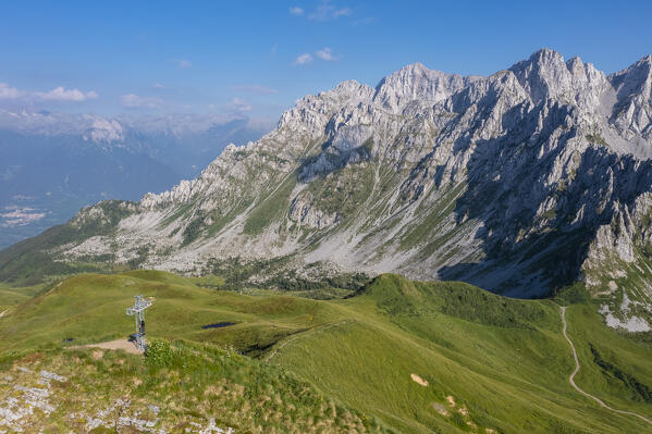 Aerial view of cross on the top of Monte Campioncino towards Valcamonica and Concarena in spring. Cerveno, Val Camonica, Brescia district, Lombardy, Italy, Southern Europe.
