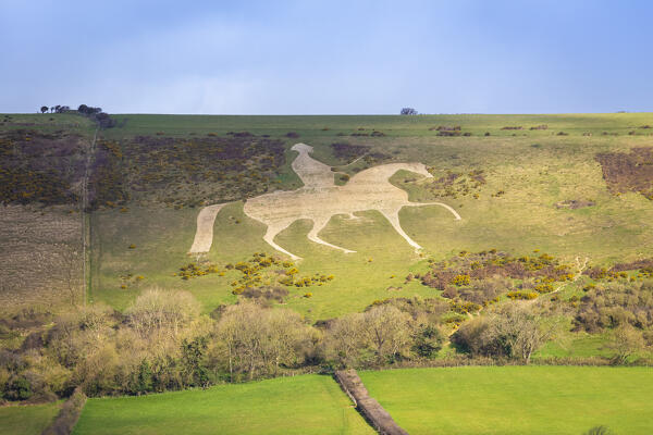 View of the limestone figure called Osmington White Horse on a hill near Weymouth. Dorset, England, United Kingdom.