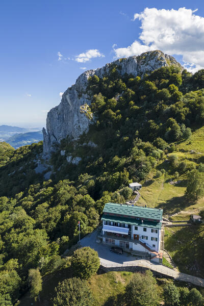 Aerial view of Rifugio Sev dominating on Como Lake (Lecco branch) and located below Corni di Canzo mountains. Valbrona, Como district, Lombardy, Italy, Europe