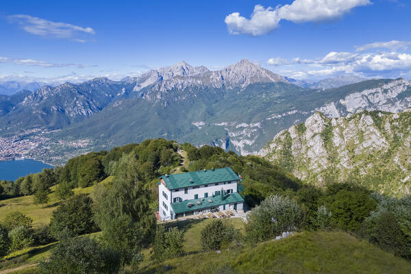 Aerial view of Rifugio Sev dominating on Como Lake (Lecco branch) and located below Corni di Canzo mountains. Valbrona, Como district, Lombardy, Italy, Europe