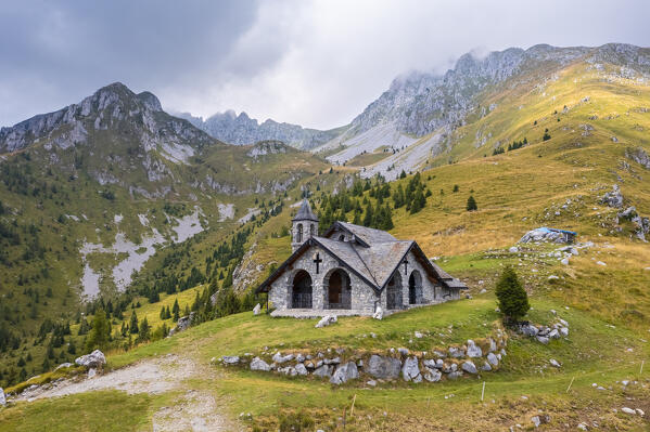 Aerial view of the Chiesetta degli Alpini church and Cima Moren of Pizzo Camino. Borno, Valcamonica, brescia district, Lombardy, Italy.