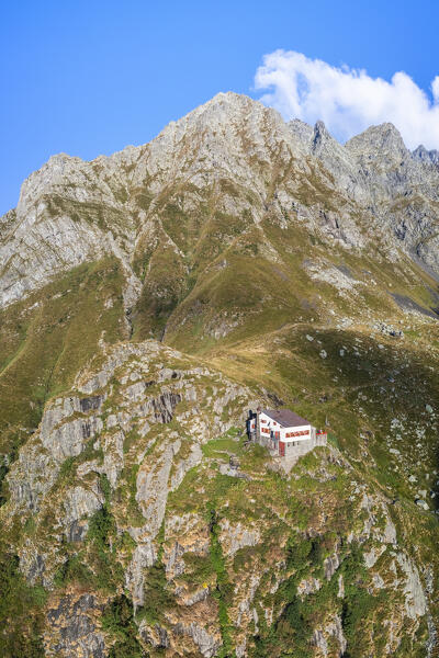 Aerial view of Rifugio Merelli al Coca on a cliff overlooking Valbondione town. Valbondione, Seriana Valley, Lombardy, Bergamo province, Italy.