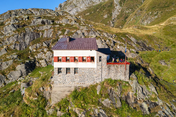 Aerial view of Rifugio Merelli al Coca on a cliff overlooking Valbondione town. Valbondione, Seriana Valley, Lombardy, Bergamo province, Italy.