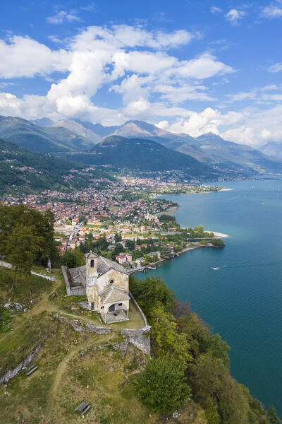 Aerial view of the church of Sant'Eufemia in Musso overlooking Lake Como. Musso, Como district, Lake Como, Lombardy, Italy