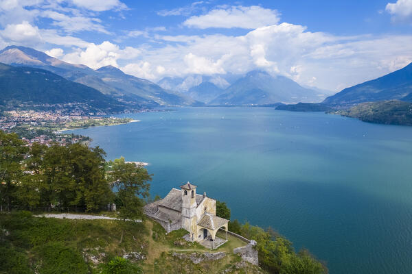 Aerial view of the church of Sant'Eufemia in Musso overlooking Lake Como. Musso, Como district, Lake Como, Lombardy, Italy