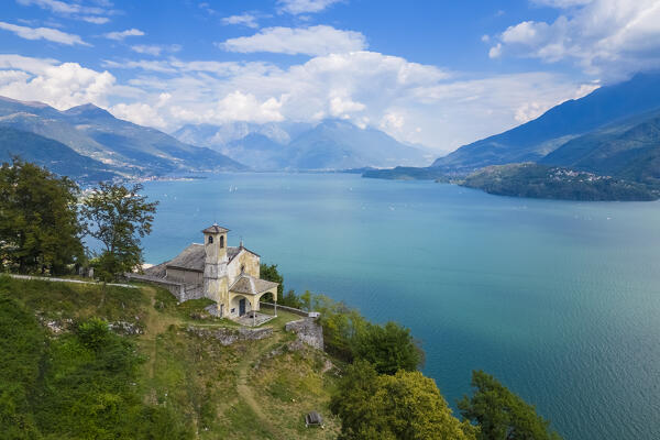 Aerial view of the church of Sant'Eufemia in Musso overlooking Lake Como. Musso, Como district, Lake Como, Lombardy, Italy