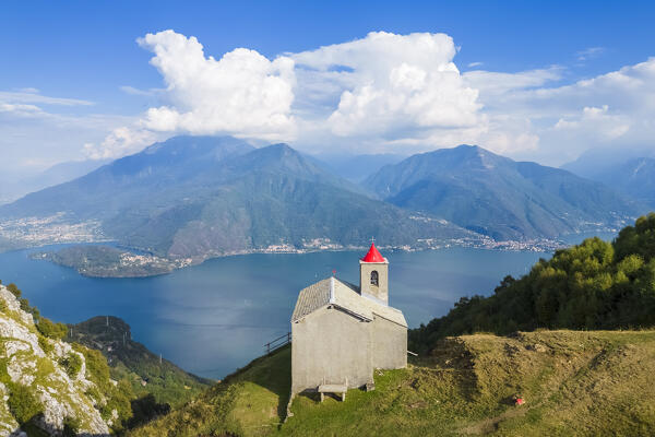 Aerial view of the church of San Bernardo on the mounts over Musso overlooking Lake Como. Musso, Como district, Lake Como, Lombardy, Italy. 
