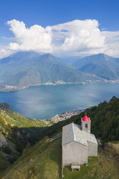 Aerial view of the church of San Bernardo on the mounts over Musso overlooking Lake Como. Musso, Como district, Lake Como, Lombardy, Italy. 