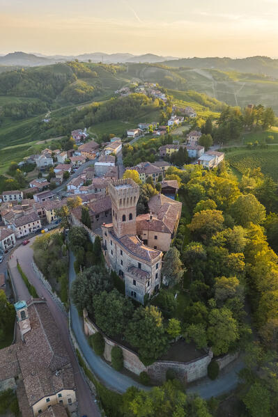 Aerial view of a summer sunset over the Cigognola castle. Cigognola, Oltrepo Pavese, Pavia district, Lombardy, Italy.