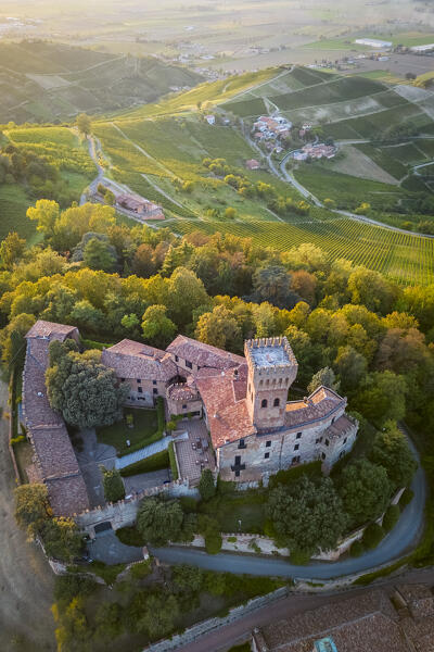 Aerial view of a summer sunset over the Cigognola castle. Cigognola, Oltrepo Pavese, Pavia district, Lombardy, Italy.