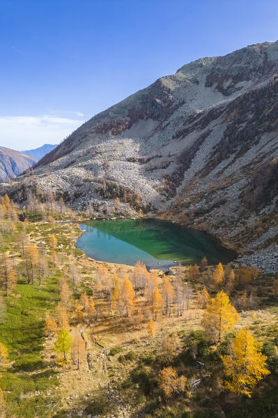 Aerial view of the Ragozza lake in autumn. Bognanco, Val Bognanco, Piedmont, Italy.
