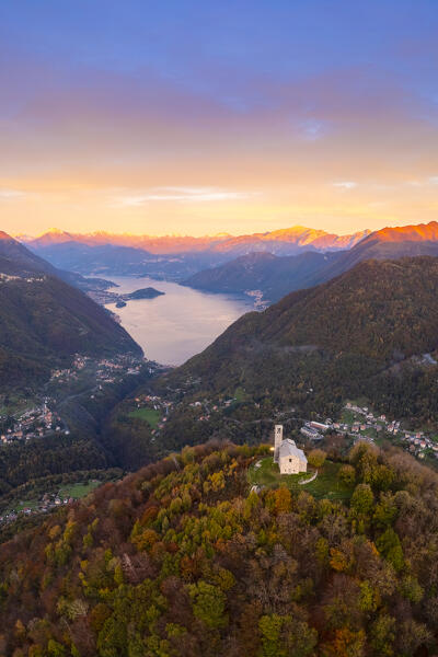 Sunset over Lake Como viewed from San Zeno hermitage on the top of Intelvi Valley in autumn. Cerano d'Intelvi, Como distric, Lake Como, Lombardy, Italy.