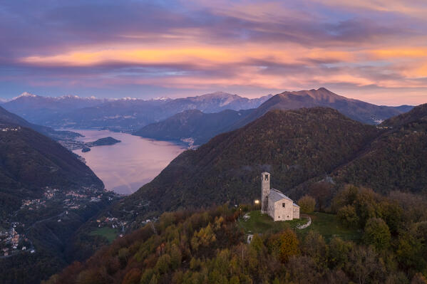 Sunset over Lake Como viewed from San Zeno hermitage on the top of Intelvi Valley in autumn. Cerano d'Intelvi, Como distric, Lake Como, Lombardy, Italy.