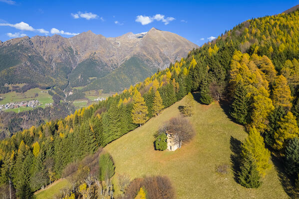 Aerial view of a small hunting hut called roccolo in autumn. Azzone, Scalve valley, Bergamo province, Lombardy, Italy.