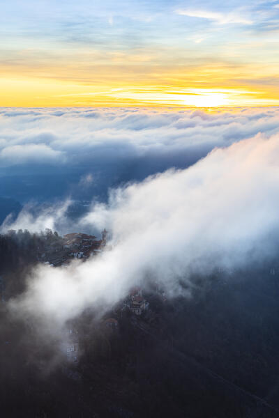Sunrise view of the town of Santa Maria del Monte in winter from the Campo dei Fiori. Campo dei Fiori, Varese, Parco Campo dei Fiori, Lombardy, Italy.