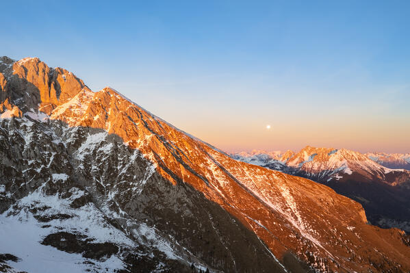 Aerial view of the Presolana mountain in winter at sunset. Val Seriana, Castione della Presolana, Bergamo district, Lombardy, Italy, Southern Europe.