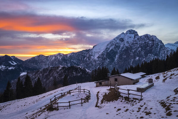 View of Malga Creisa and the Presolana east face at sunset in winter from Borno, Valcamonica. Borno, Valcamonica valley, Brescia province, Lombardy, Italy.