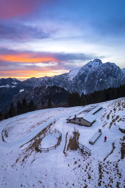 View of Malga Creisa and the Presolana east face at sunset in winter from Borno, Valcamonica. Borno, Valcamonica valley, Brescia province, Lombardy, Italy.