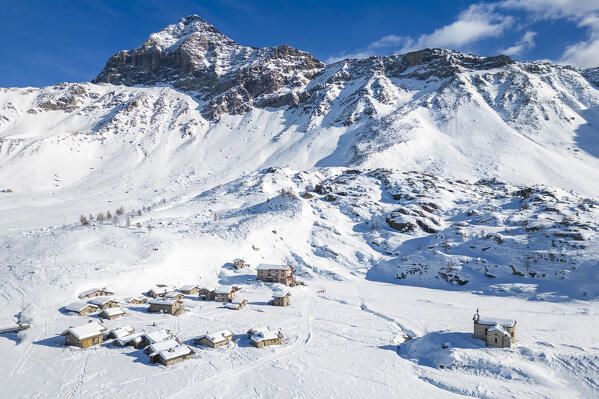 Rifugio Cristina and Pizzo Scalino in winter. Lanzada, Valmalenco, Valtellina, Sondrio district, Lombardy, Italy, Europe.