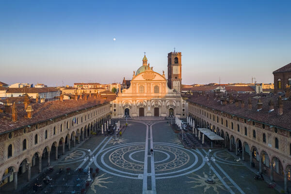 Aerial view of the Vigevano Cathedral and Piazza Ducale in spring at sunset. Vigevano, Lomellina, Province of Pavia, Lombardy, Italy.