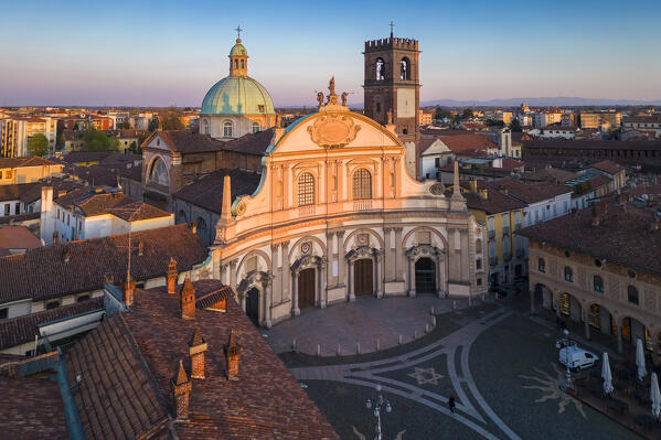 Aerial view of the Vigevano Cathedral and Piazza Ducale in spring at sunset. Vigevano, Lomellina, Province of Pavia, Lombardy, Italy.