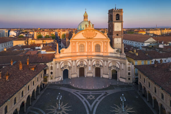 Aerial view of the Vigevano Cathedral and Piazza Ducale in spring at sunset. Vigevano, Lomellina, Province of Pavia, Lombardy, Italy.