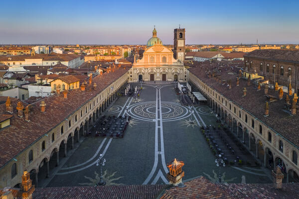 Aerial view of the Vigevano Cathedral and Piazza Ducale in spring at sunset. Vigevano, Lomellina, Province of Pavia, Lombardy, Italy.