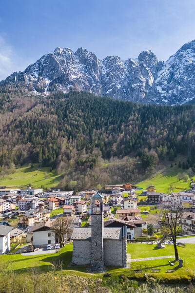 Aerial view of the small church called Cesulì in Colere town with view of the north face of the Presolana mountain in spring. Colere, Val di Scalve, Bergamo district, Lombardy, Italy, Southern Europe.