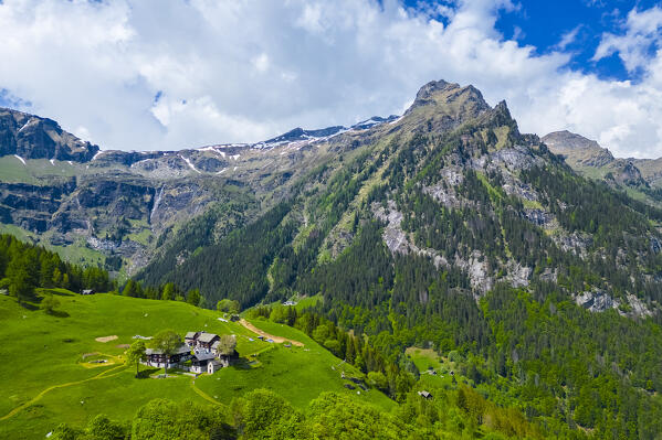 Aerial view of the small mountain walser town of Case Francoli in spring. Premia, Valle Antigorio, Verbano Cusio Ossola, Piedmont, Italy.