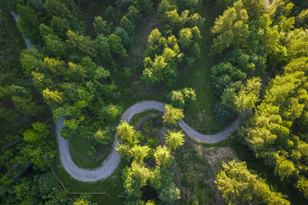 Aerial view of the winding road leading to Fort Mutin in Fenestrelle. Orsiera Rocciavre Park, Chisone Valley, Turin, Piedmont, Italy.