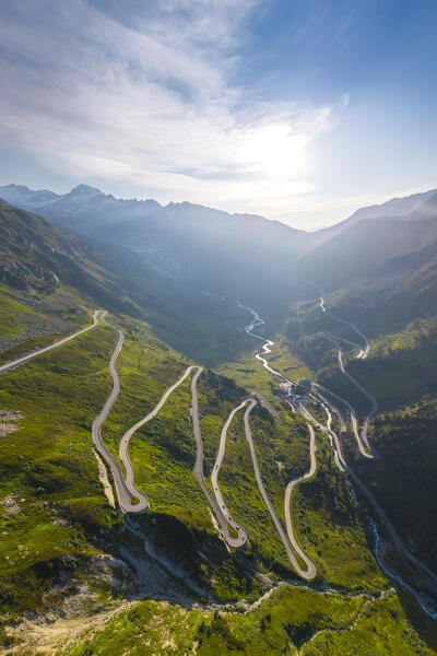 Aerial view of the Grimselstrasse connecting with Furkastrasse and Furkapass at sunrise. Obergoms, Canton of Valais, Swiss Alps, Switzerland.