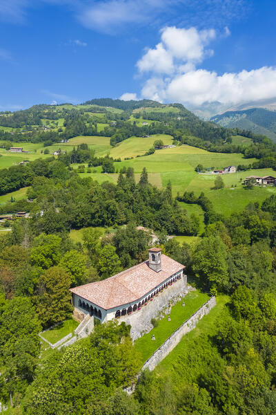Aerial view of the Santissima Trinità di Parre church on a hill overlooking Valle Seriana. Val Seriana, Bergamo province, Lombardy, Italy.