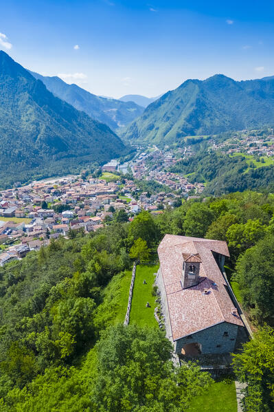 Aerial view of the Santissima Trinità di Parre church on a hill overlooking Valle Seriana. Val Seriana, Bergamo province, Lombardy, Italy.