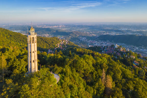 Aerial view of the Faro Voltiano (Volta Lighthouse) of Brunate overlooking Como and Como Lake in summer at sunset. Brunate, Province of Como, Lombardy, Italy, Europe.