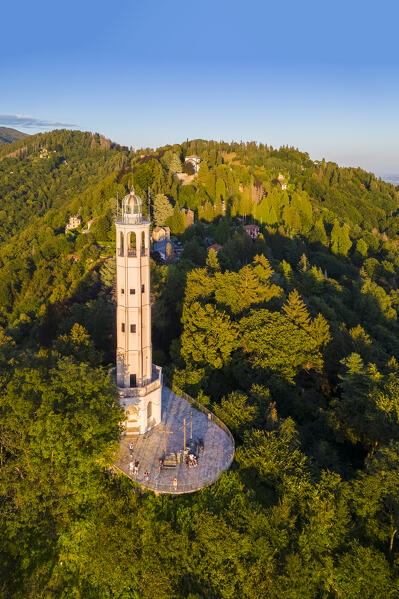 Aerial view of the Faro Voltiano (Volta Lighthouse) of Brunate overlooking Como and Como Lake in summer at sunset. Brunate, Province of Como, Lombardy, Italy, Europe.
