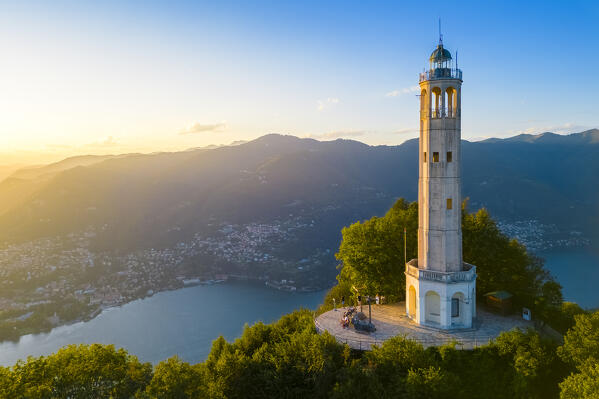 Aerial view of the Faro Voltiano (Volta Lighthouse) of Brunate overlooking Como and Como Lake in summer at sunset. Brunate, Province of Como, Lombardy, Italy, Europe.