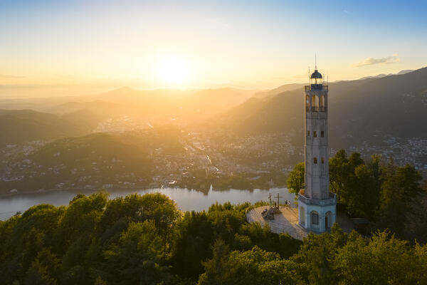 Aerial view of the Faro Voltiano (Volta Lighthouse) of Brunate overlooking Como and Como Lake in summer at sunset. Brunate, Province of Como, Lombardy, Italy, Europe.