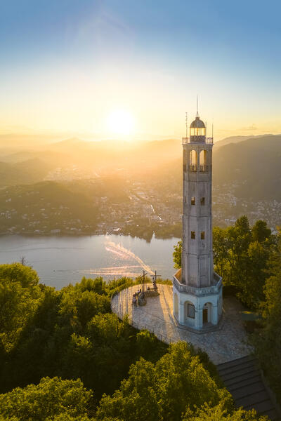 Aerial view of the Faro Voltiano (Volta Lighthouse) of Brunate overlooking Como and Como Lake in summer at sunset. Brunate, Province of Como, Lombardy, Italy, Europe.