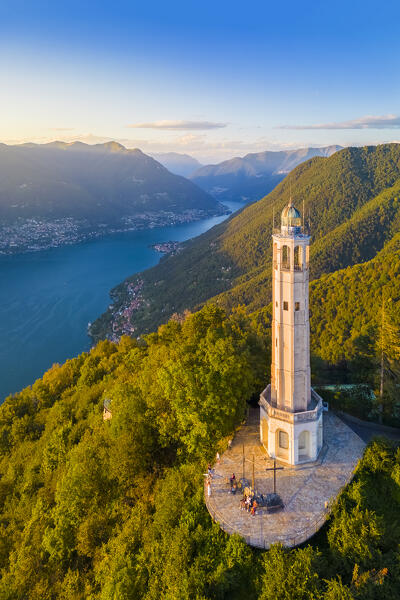 Aerial view of the Faro Voltiano (Volta Lighthouse) of Brunate overlooking Como and Como Lake in summer at sunset. Brunate, Province of Como, Lombardy, Italy, Europe.