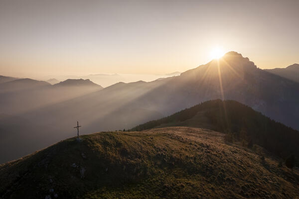 Aerial view of the Presolana mount at sunset in autumn from Malga Costone, part of Pizzo Camino. Borno, Valcamonica, brescia district, Lombardy, Italy.