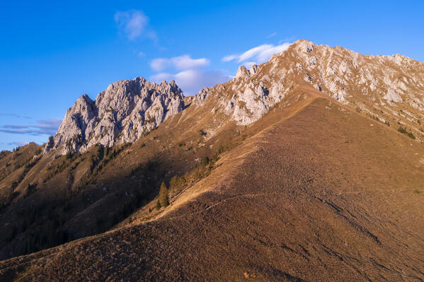 Aerial view of the Corna di San Fermo from the hill called Costone, part of Pizzo Camino, at sunset. Borno, Valcamonica, brescia district, Lombardy, Italy.