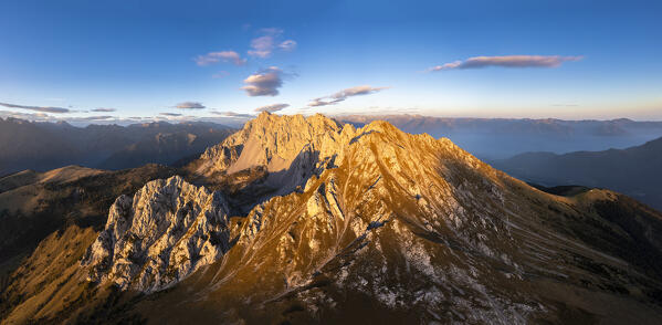 Aerial view of the Corna di San Fermo and Cima Moren, part of Pizzo Camino, at sunset. Borno, Valcamonica, brescia district, Lombardy, Italy.