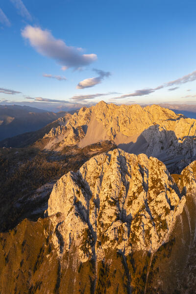 Aerial view of the Corna di San Fermo and Cima Moren, part of Pizzo Camino, at sunset. Borno, Valcamonica, brescia district, Lombardy, Italy.
