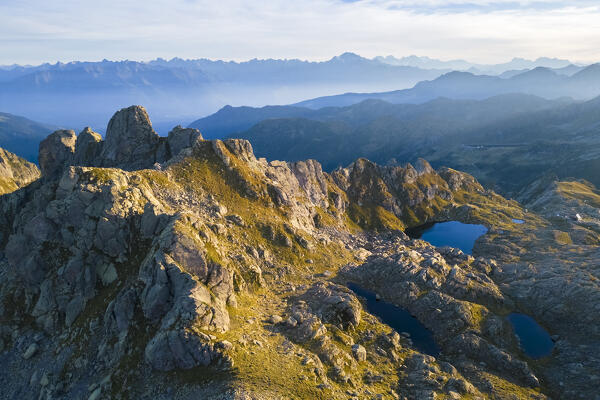 Aerial view of the Lago Piazzotti at sunset. Ornica, Val Salmurano, Val Brembana, Alpi Orobie, Bergamo, Bergamo Province, Lombardy, Italy, Europe.