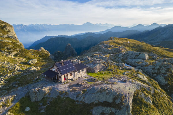Aerial view of the Rifugio Benigni at sunrise. Ornica, Val Salmurano, Val Brembana, Alpi Orobie, Bergamo, Bergamo Province, Lombardy, Italy, Europe.