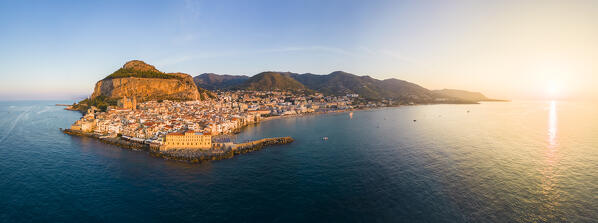 Aerial view of the ancient town of Cefalù, Unesco World Heritage site, at sunset. Palermo district, Sicily, Italy.