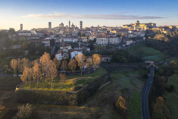View of the rooftops, churches and towers of the Upper Town (Città Alta) of Bergamo city at sunrise. Bergamo, Lombardy, Italy.