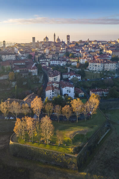 View of the rooftops, churches and towers of the Upper Town (Città Alta) of Bergamo city at sunrise. Bergamo, Lombardy, Italy.