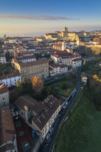 View of the rooftops, churches and towers of the Upper Town (Città Alta) of Bergamo city at sunrise. Bergamo, Lombardy, Italy.